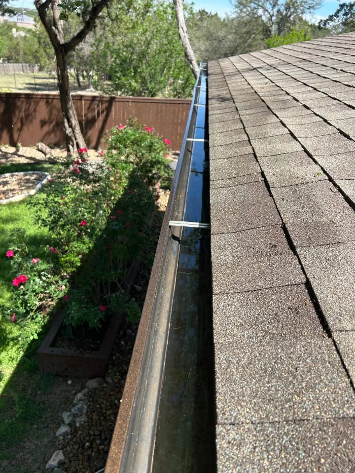 Inside of a seamless gutter run showing hidden hangers