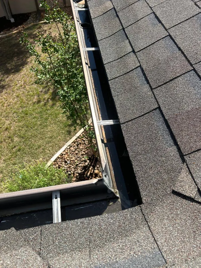 Sealed gutter corner and miter on a finished installation