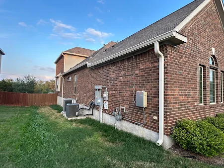 Gutters and downspout on a brick home