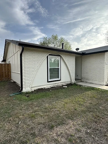 Seamless gutters and downspout on a white home