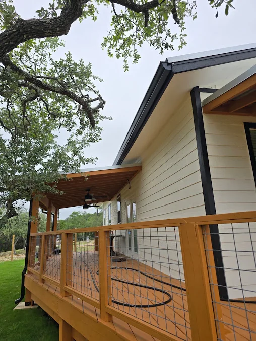 Gutters and downspout on a home with a covered deck