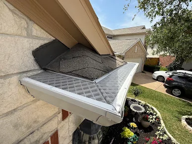Micro-mesh gutter guard fitted along a gutter run